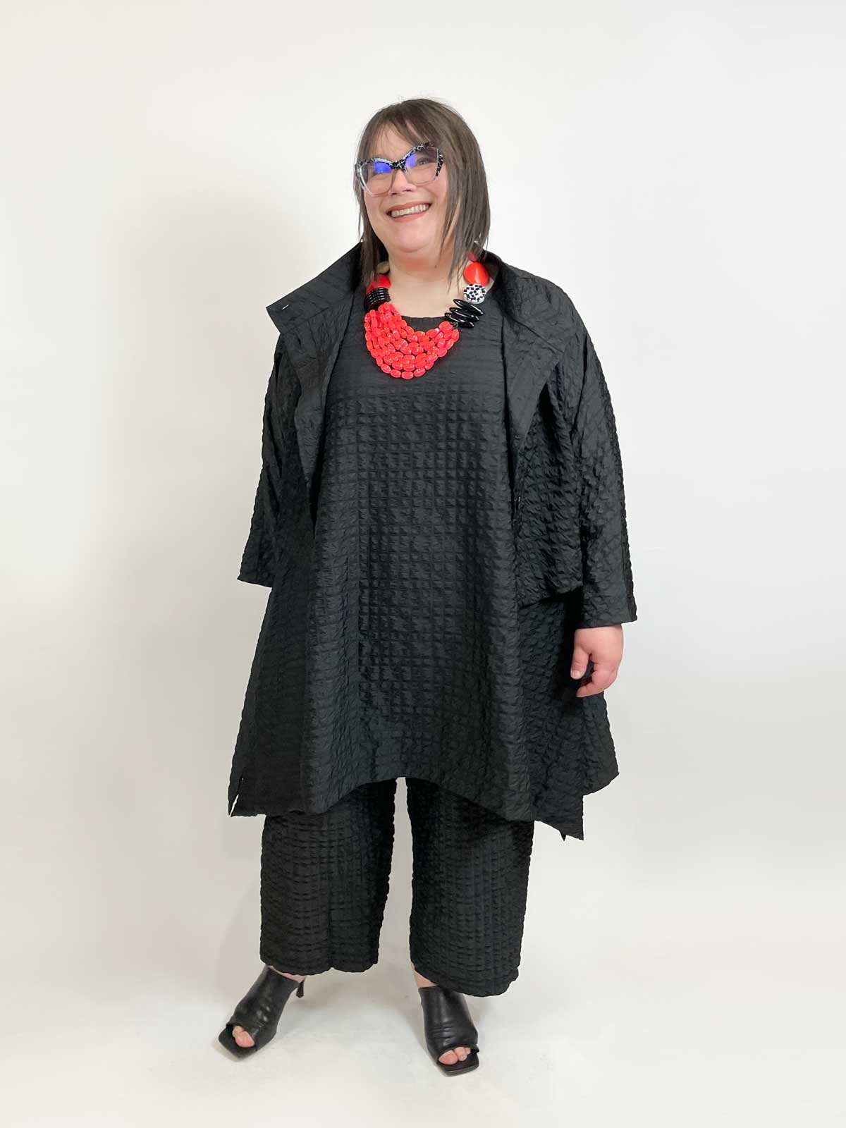 Andrea models Kedem Sasson SS23 Styles in Black with a Michaela Malin necklace